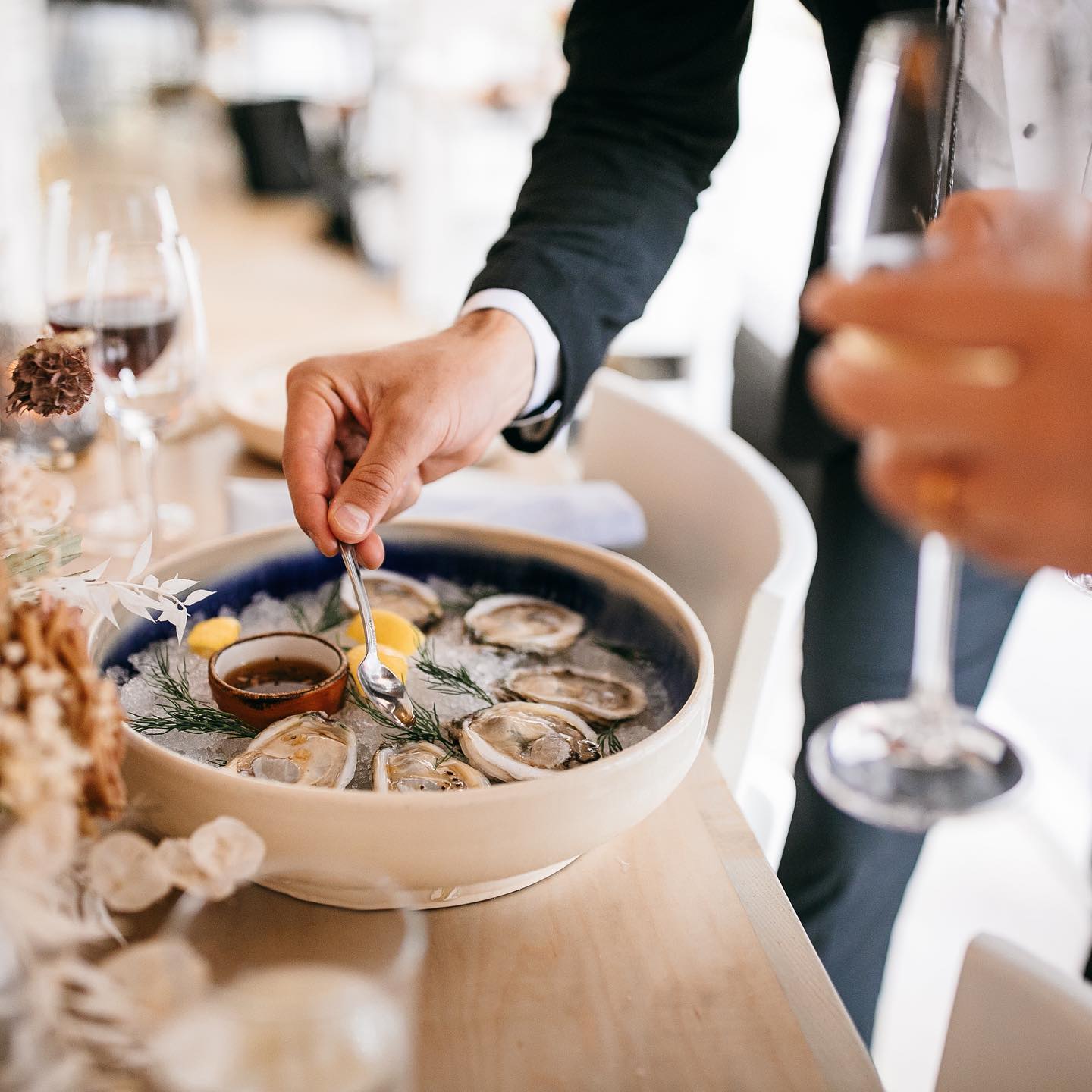 A guest enjoying a selection from our raw oyster bar in Chattanooga.