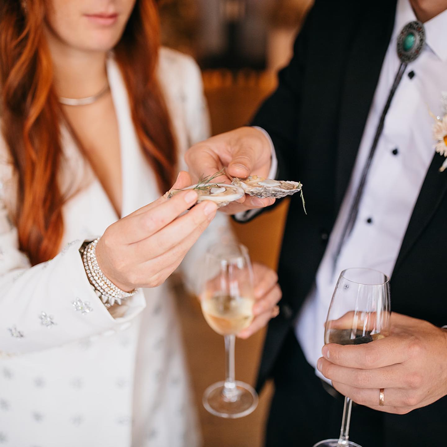 A happy couple toasting in our raw oyster bar in Chattanooga.